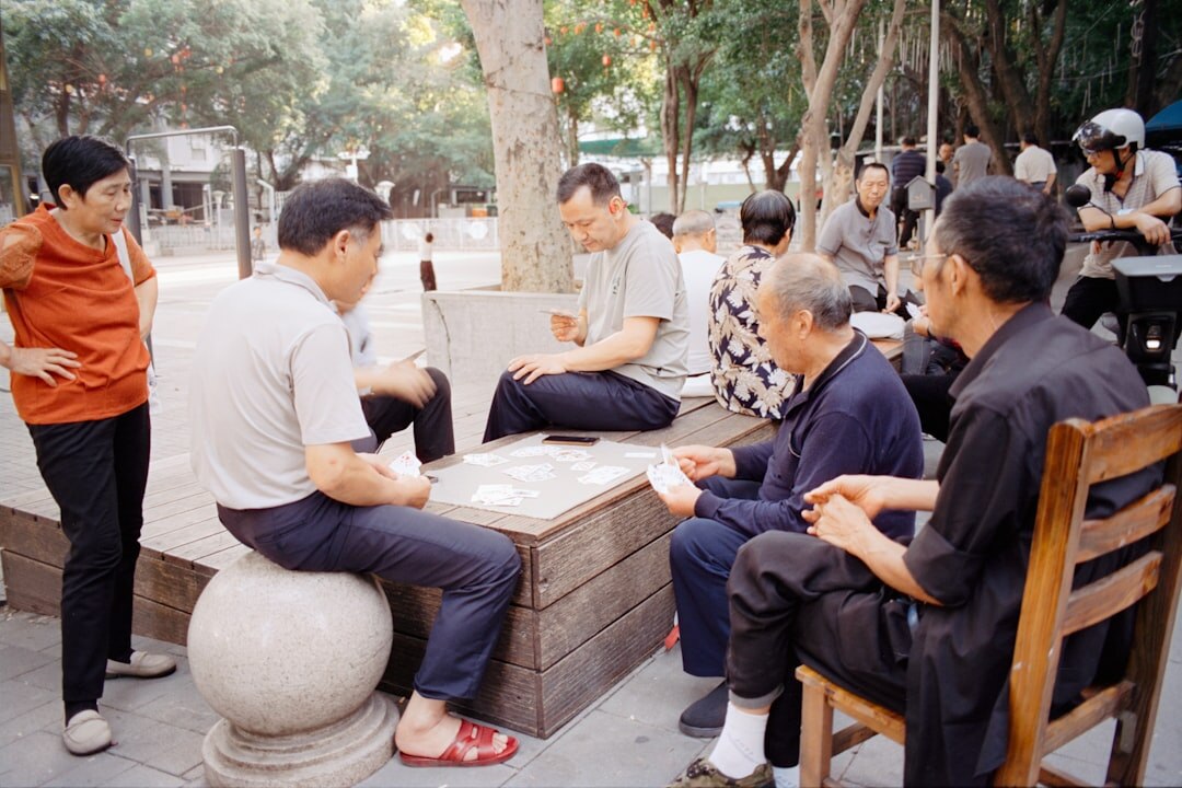 elderly group playing cards