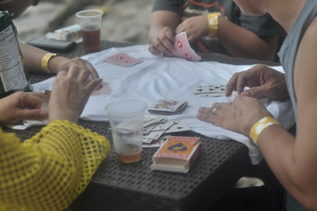 group of seniors playing cards