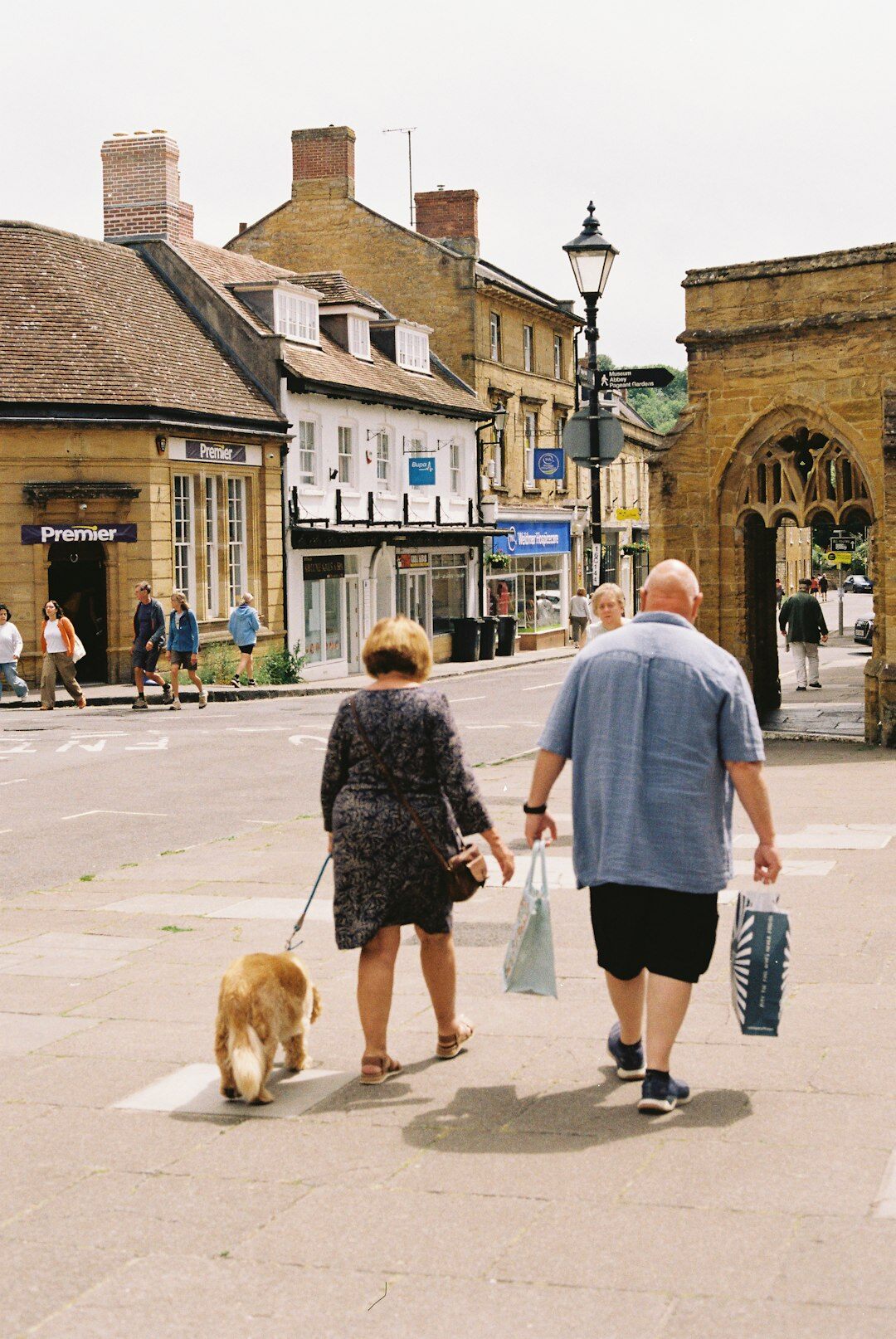 senior couple walking in neighborhood